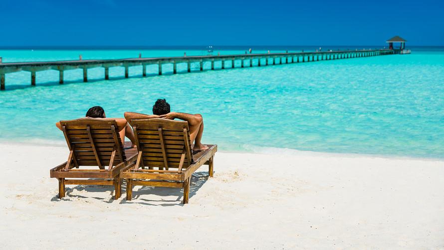 Man and woman relaxing on a beach