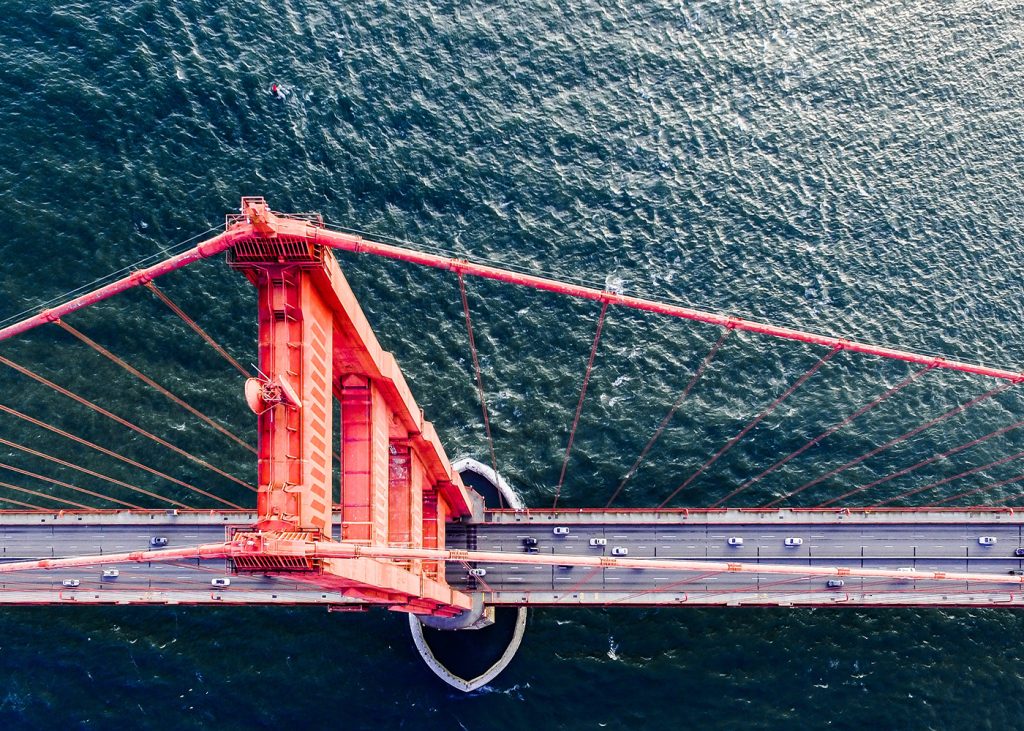 An overhead perspective of the Golden Gate Bridge, displaying its magnificent architecture and scenic surroundings.